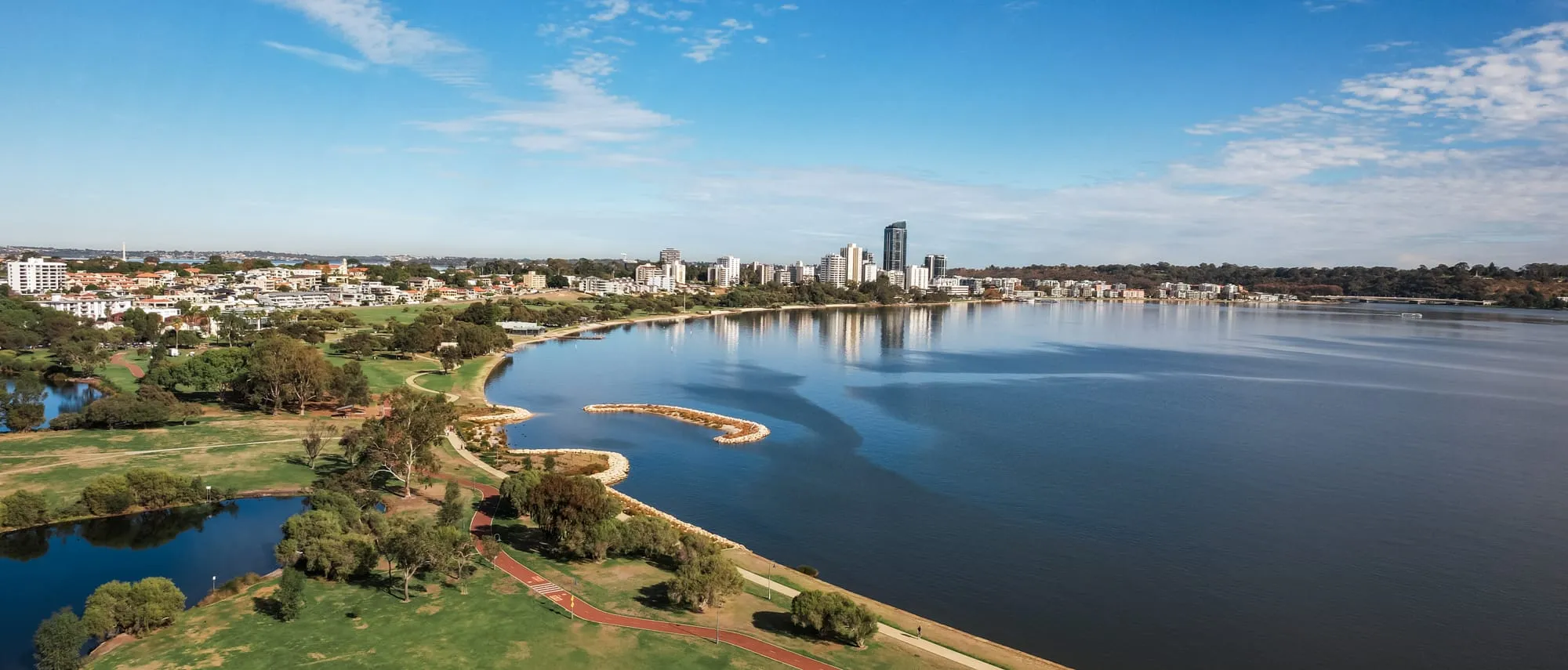 The South Perth foreshore with the Perth city skyline across the Swan River.